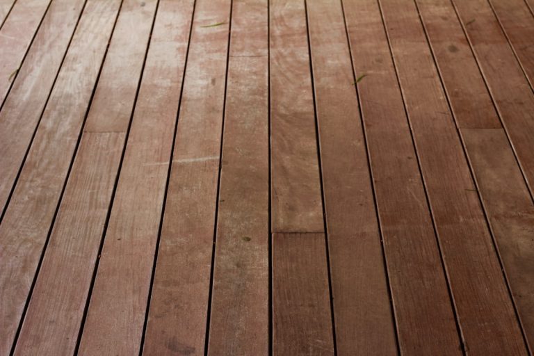 Bare hardwood floorboards ready for refinishing